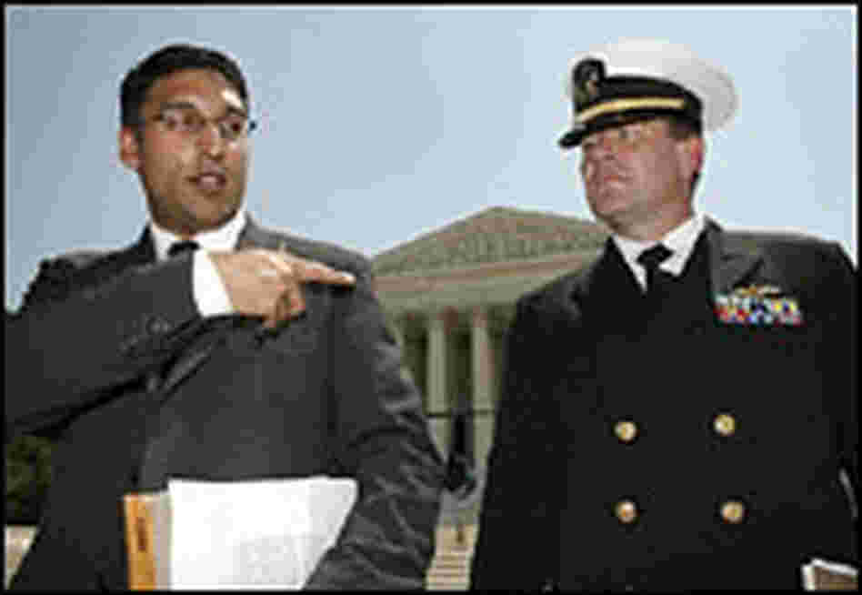 Neal Katyal and U.S. Navy Lt. Cmdr. Charles Swift appear outside the Supreme Court building.