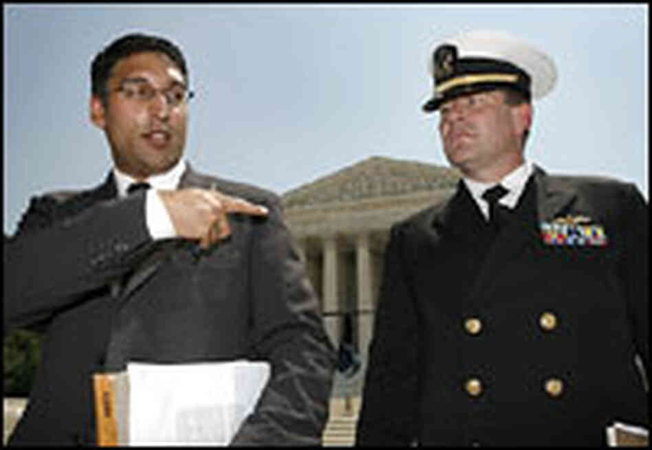 Neal Katyal and U.S. Navy Lt. Cmdr. Charles Swift appear outside the Supreme Court building.