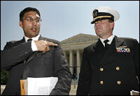 Attorney Neal Katyal, left, and U.S. Navy Lt. Cmdr. Charles Swift, who represented Guantanamo Bay detainee Salim Ahmed Hamdan, speak after the Supreme Court ruled against proposed military tribunals June 29, 2006.
