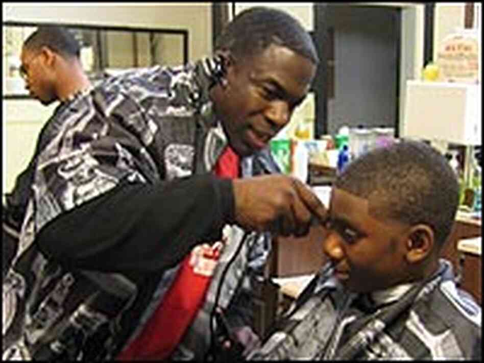 Kali Kirkendale, cutting hair in his barber shop in East Oakland. Kali Kirkendale, cutting hair in his barber shop in East Oakland.