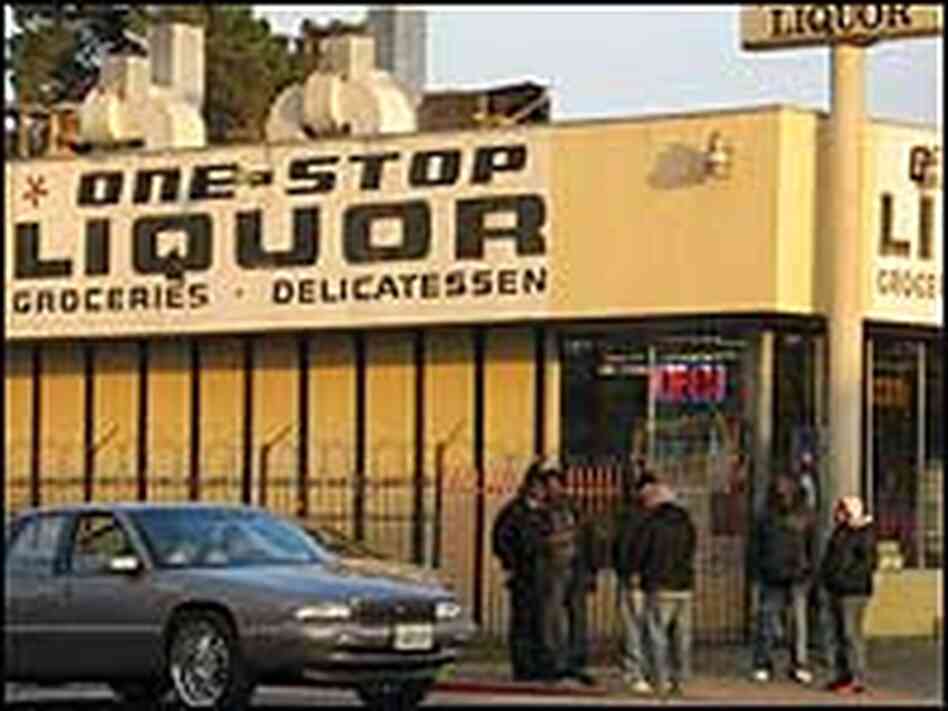 Young black men hang out in front of a liquor store in Oakland, California. Young black men hang out in front of a liquor store in Oakland, California.