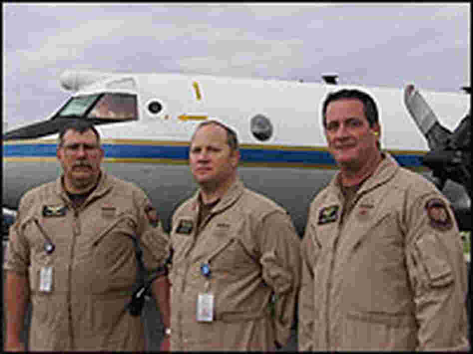Detection systems specialists standing in front of and aircraft used to seize illegal drugs. Detection systems specialists standing in front of and aircraft used to seize illegal drugs.