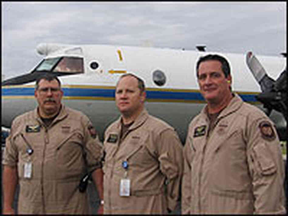 Detection systems specialists standing in front of and aircraft used to seize illegal drugs. Detection systems specialists standing in front of and aircraft used to seize illegal drugs.