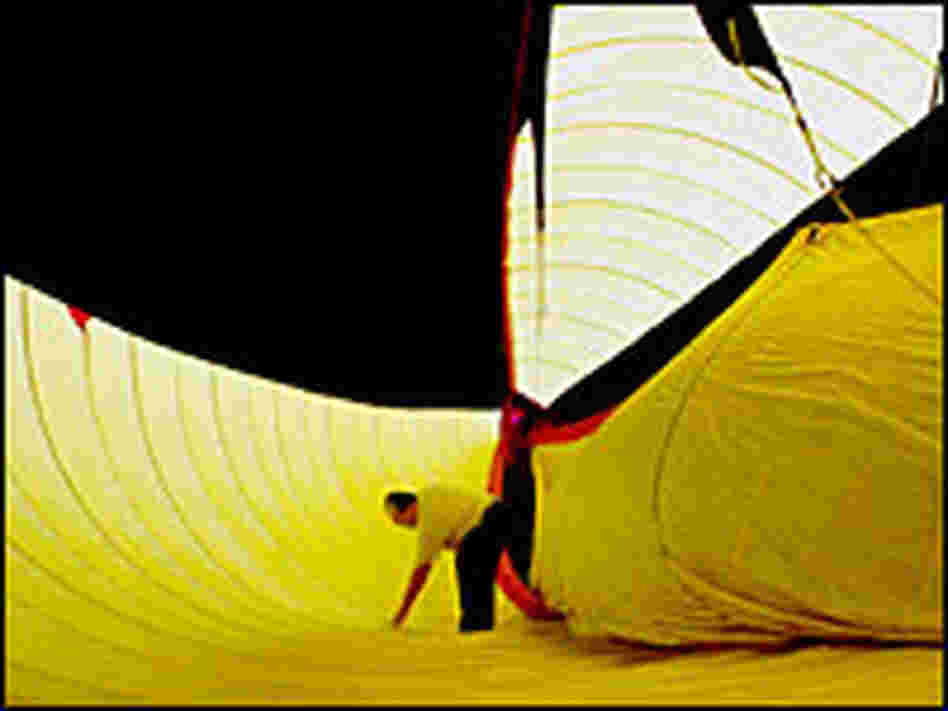 Nachbar, a former computer scientist, inspects the inside of the blimp before flight