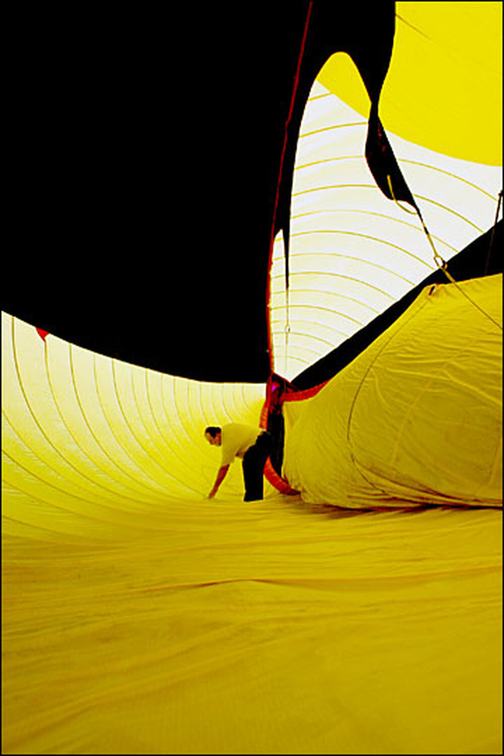 Nachbar, a former computer scientist, inspects the inside of the blimp before flight
