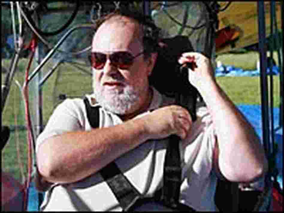 Nachbar straps himself into the blimp's open "cabin" -- a Toyota Camry seat bolted to a slab of wood
