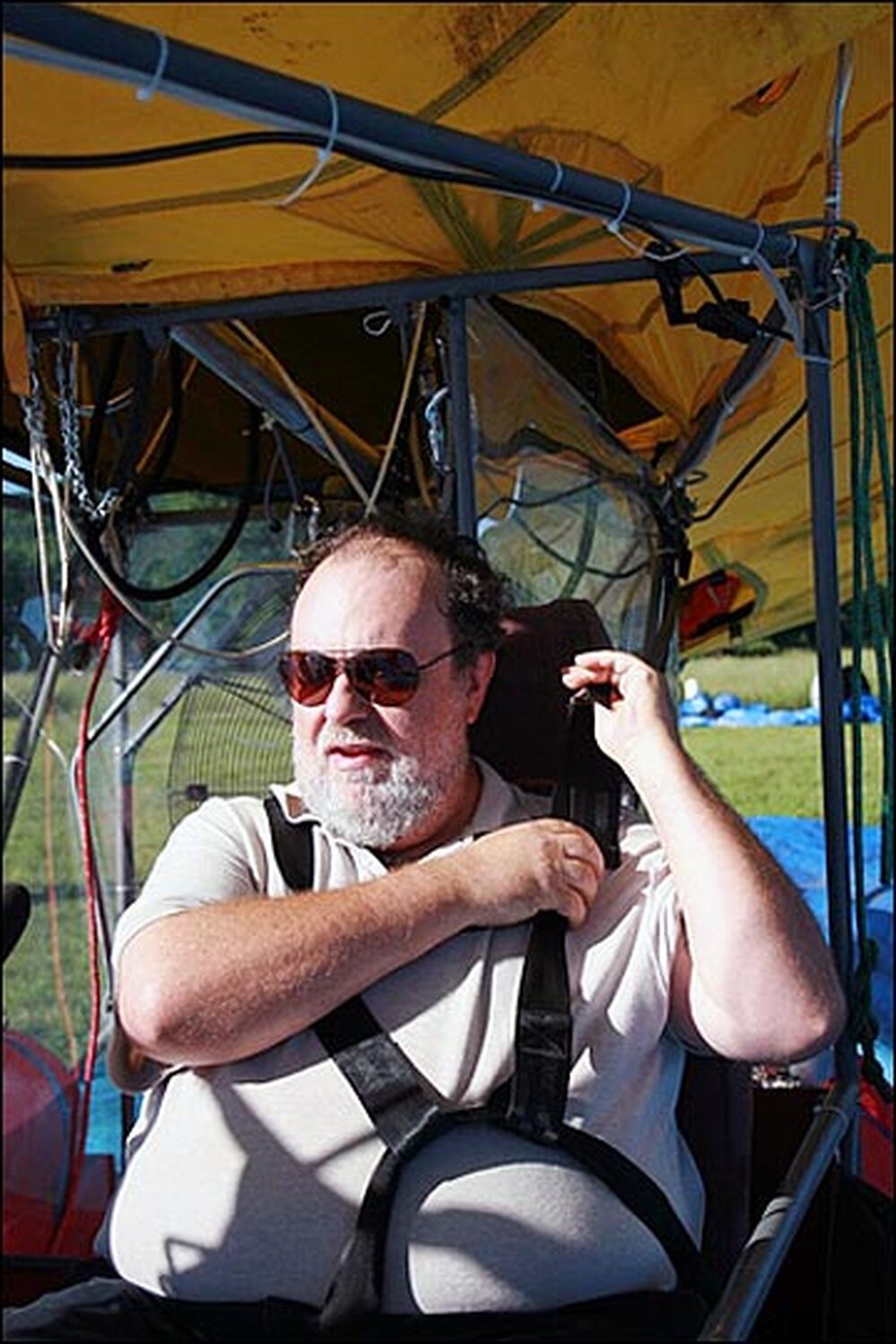 Nachbar straps himself into the blimp's open "cabin" -- a Toyota Camry seat bolted to a slab of wood