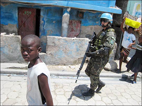 A Brazilian U.N. peacekeeper patrols the streets of Cite Soleil.