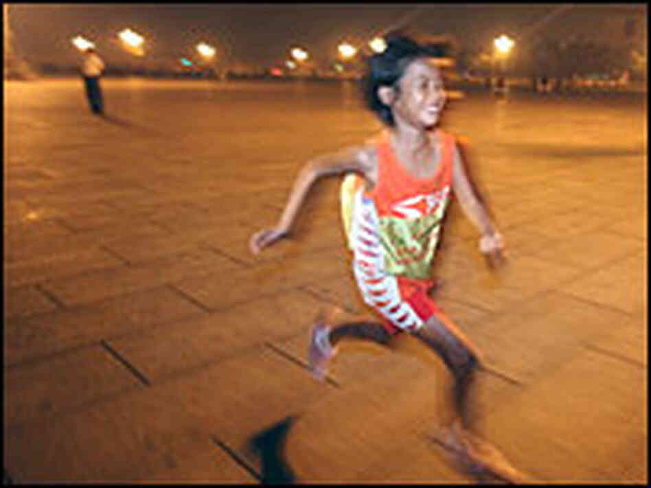 Zhang Huimin, 8, enters Tiananmen Square in Beijing early Tuesday morning