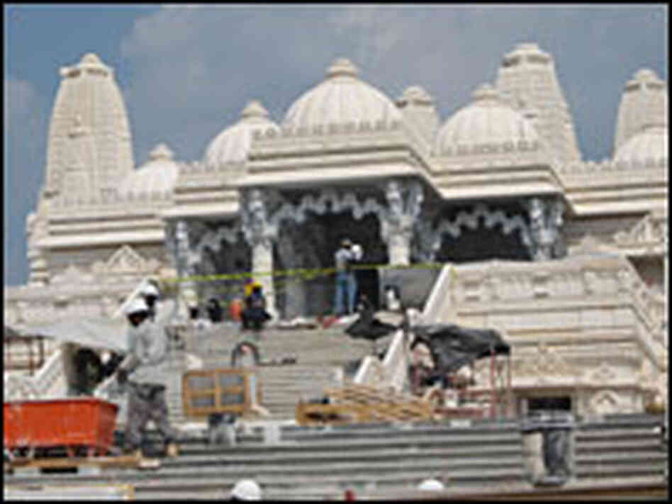 Workers in front of the temple