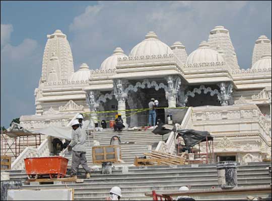 Workers in front of the temple