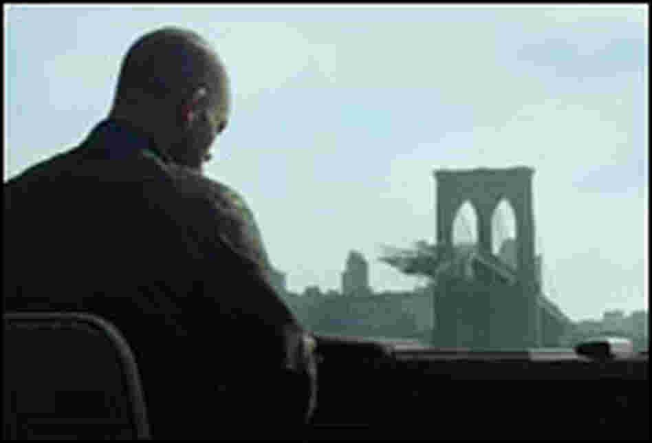 Actor Will Smith looks out over destroyed New York City in "I Am Legend."