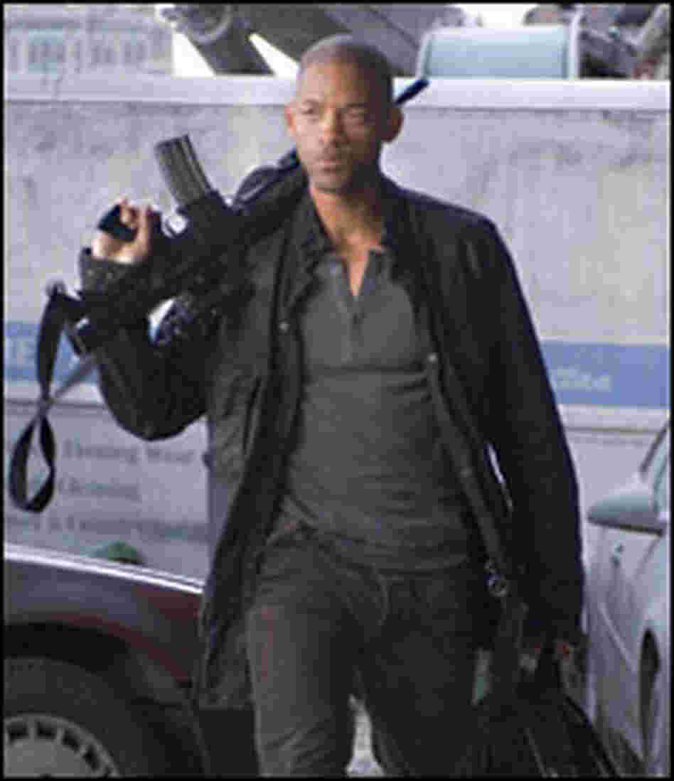 Actor Will Smith walks with gun in "I Am Legend."