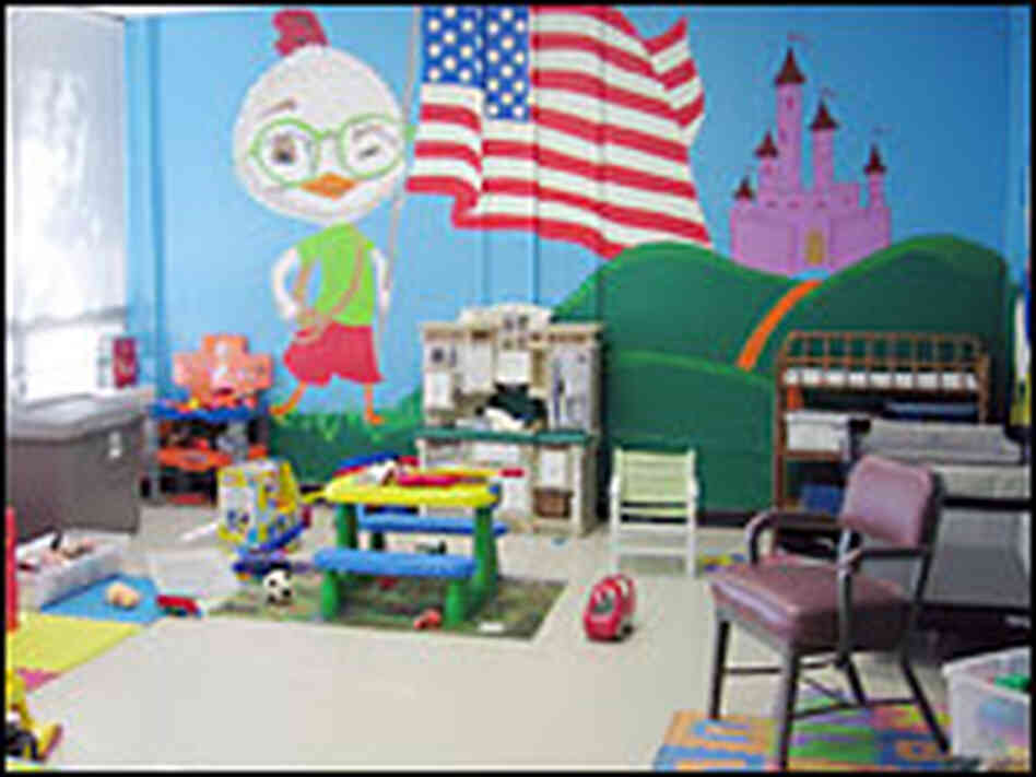hide caption Volunteers at the support center help families of those ...