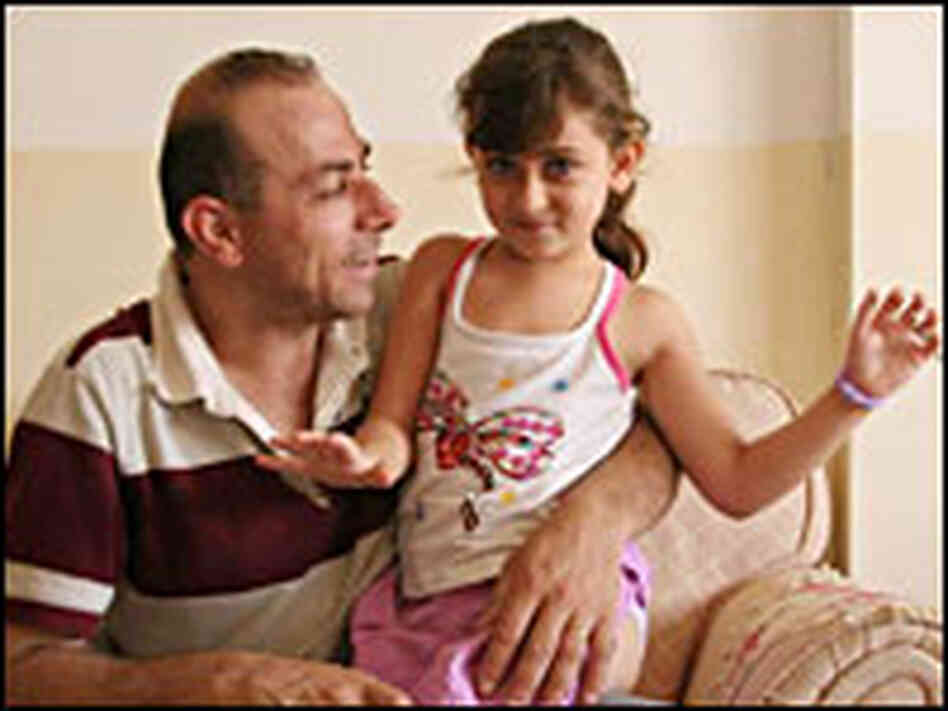 Commentator Hossam al-Madhoun with his six-year old daughter, Selma Commentator Hossam al-Madhoun with his six-year old daughter, Selma