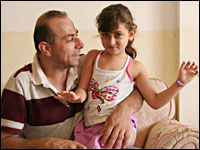 Commentator Hossam al-Madhoun with his six-year old daughter, Selma