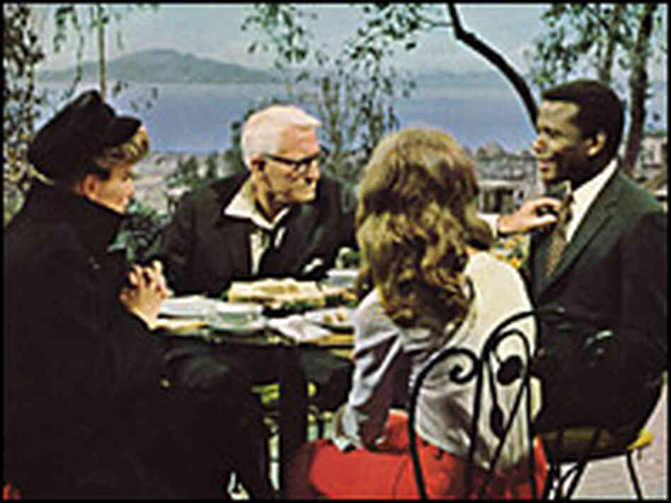 Katharine Hepburn, Spencer Tracy, Katharine Houghton and Sidney Poitier at a dinner table