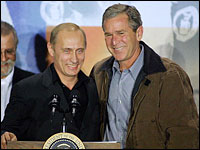 Russian President Vladimir Putin (left) and U.S. President George W. Bush share a podium — and smiles — during a press conference in 2001, before U.S.-Russian relations soured.