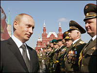 Russian President Vladimir Putin speaks with officers during a military parade in Moscow's Red Square, May 9, 2006. Putin led an elaborate ceremony marking victory in World War II and showcasing Moscow's new wealth.
