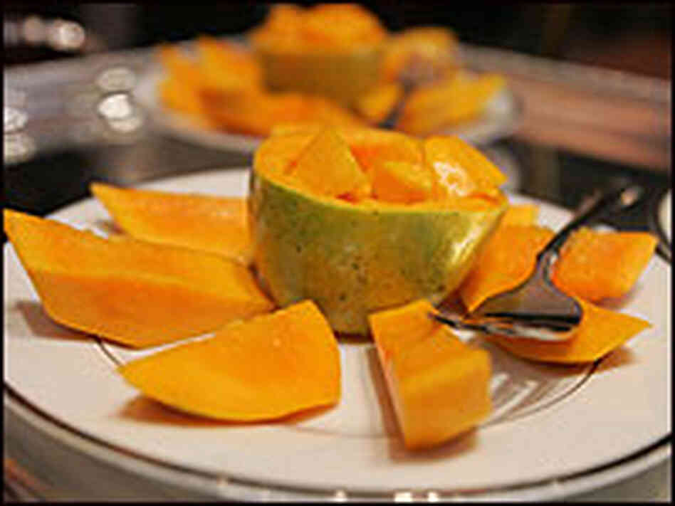 A plate of sliced mango. A plate of sliced mango.