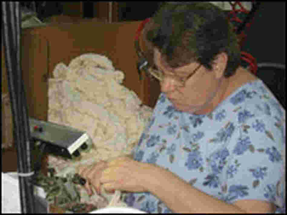 Worker seaming socks in Fort Payne, Ala.