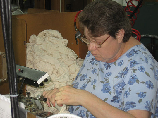 Worker seaming socks in Fort Payne, Ala.
