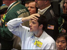 Traders work in the oil futures pit on the floor of the New York Mercantile Exchange. Traders work in the oil futures pit on the floor of the New York Mercantile Exchange.