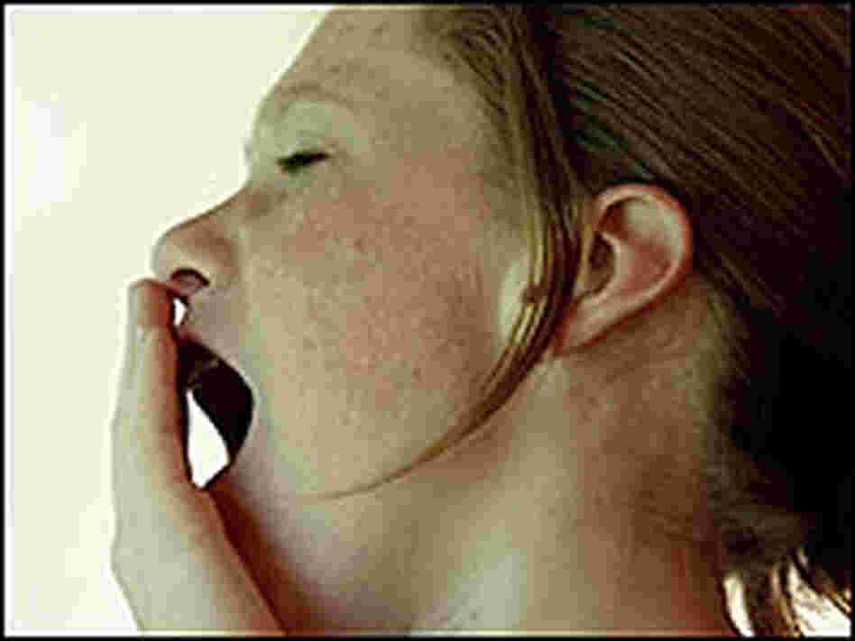 A girl yawning. A girl yawning.