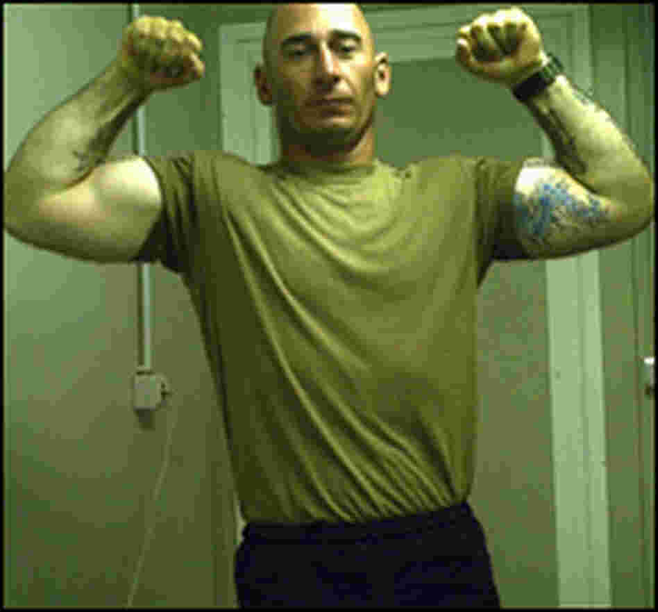 Staff Sgt. Robert Henline flexes his biceps in a photo taken in Iraq.