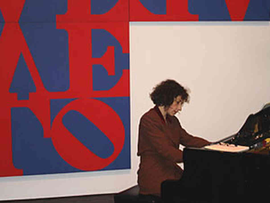 Sarah Rothenberg performs in front of Robert Indiana's "The Love Cross" Sarah Rothenberg performs in front of Robert Indiana's "The Love Cross"