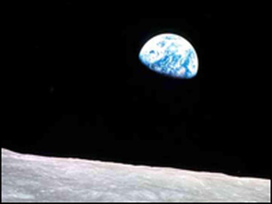 The Apollo 8 iconic image of the Earth rising over the moon's horizon.