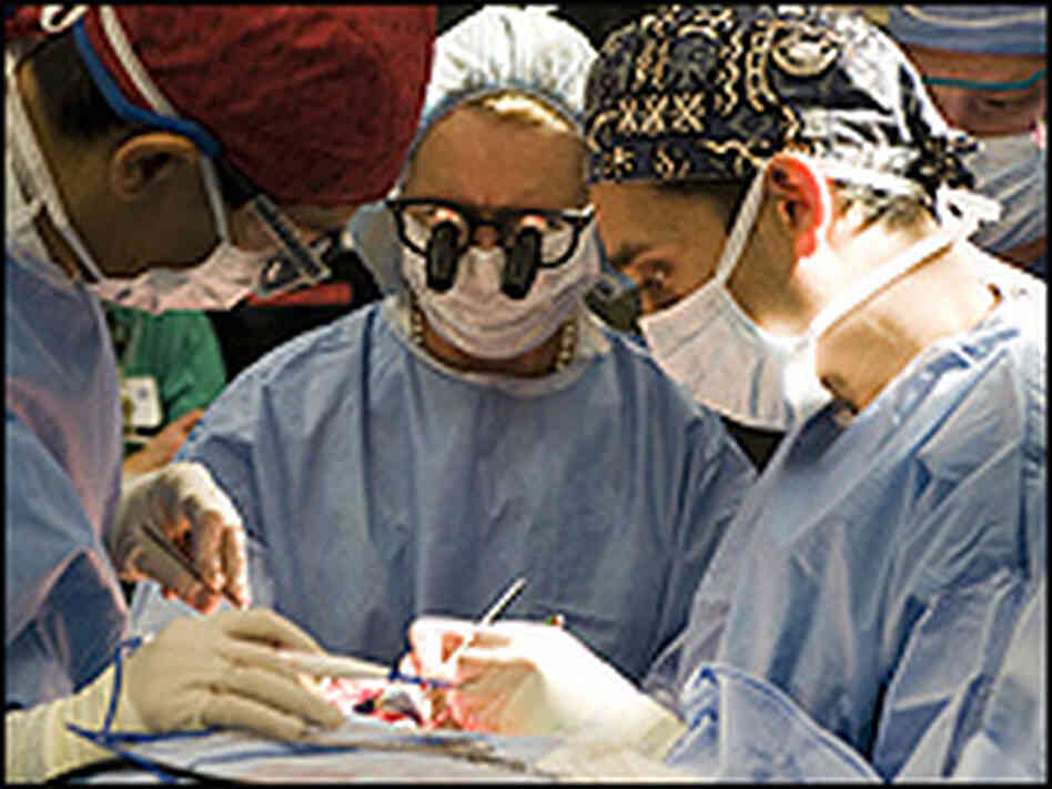 Dr. Risal Djohan, Dr. Maria Siemionow and Dr. Daniel Alam operate on the near-total face transplant. Dr. Risal Djohan, Dr. Maria Siemionow and Dr. Daniel Alam operate on the near-total face transplant.