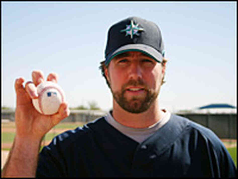 R.A. Dickey displays a signature knuckleball grip at the Seattle Mariners training camp in Arizona.