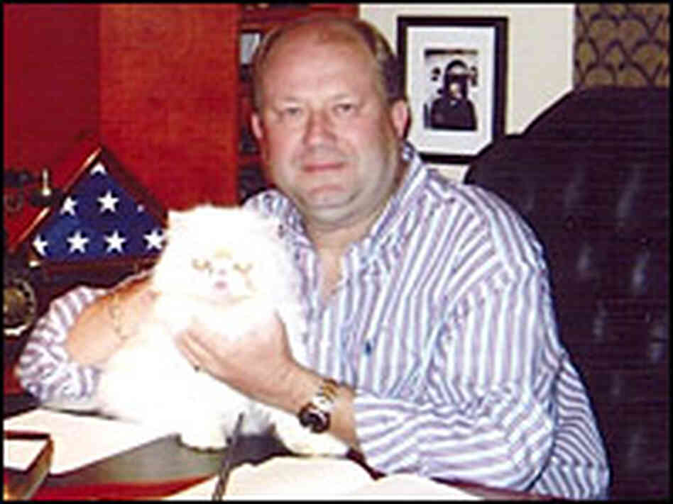 Tretyakov at home with his cat, Matilda