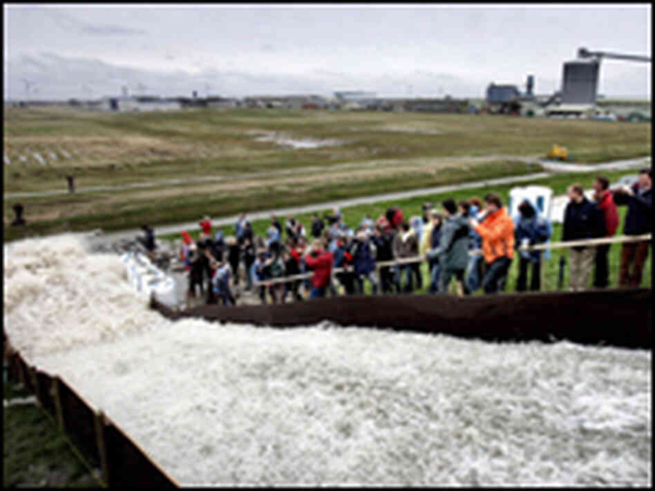 Hundreds of gallons of water flow down a hill during a dike test in Holland. Hundreds of gallons of water flow down a hill during a dike test in Holland.