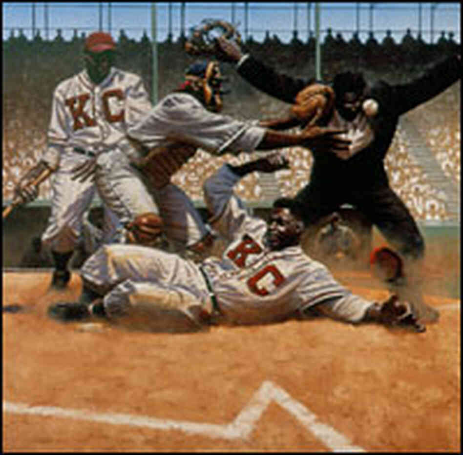 Jackie Robinson steals home past Cleveland Buckeye catcher, Quincy Trouppe.
