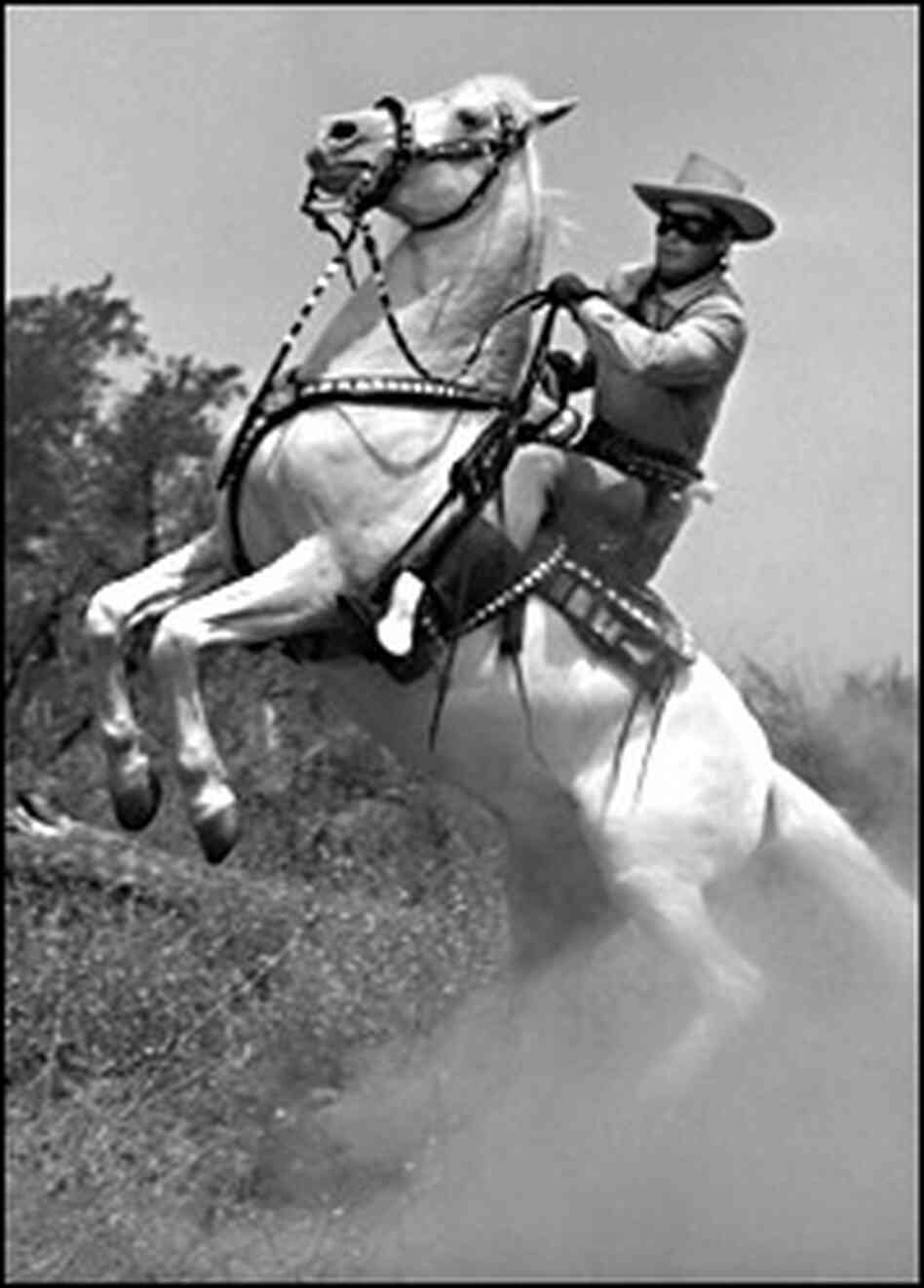 Clayton Moore as the Lone Ranger astride Silver
