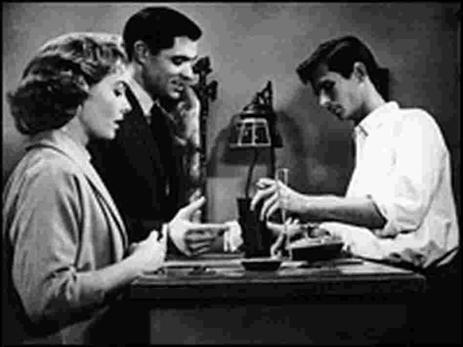 Anthony Perkins, John Gavin and Vera Miles at the Bates Motel check-in desk.