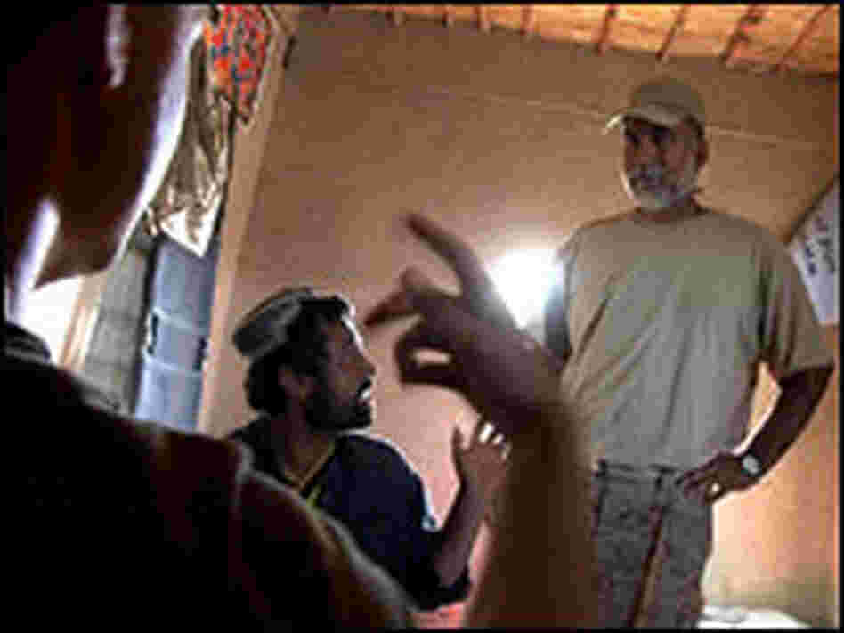 Interpreting between Marines and Afghans.