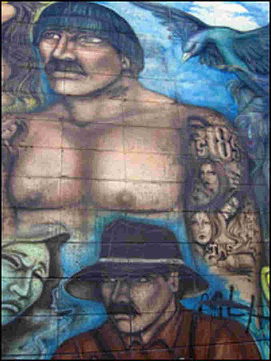 A  mural adorns a local donut shop that is said to be a gang member hang out.