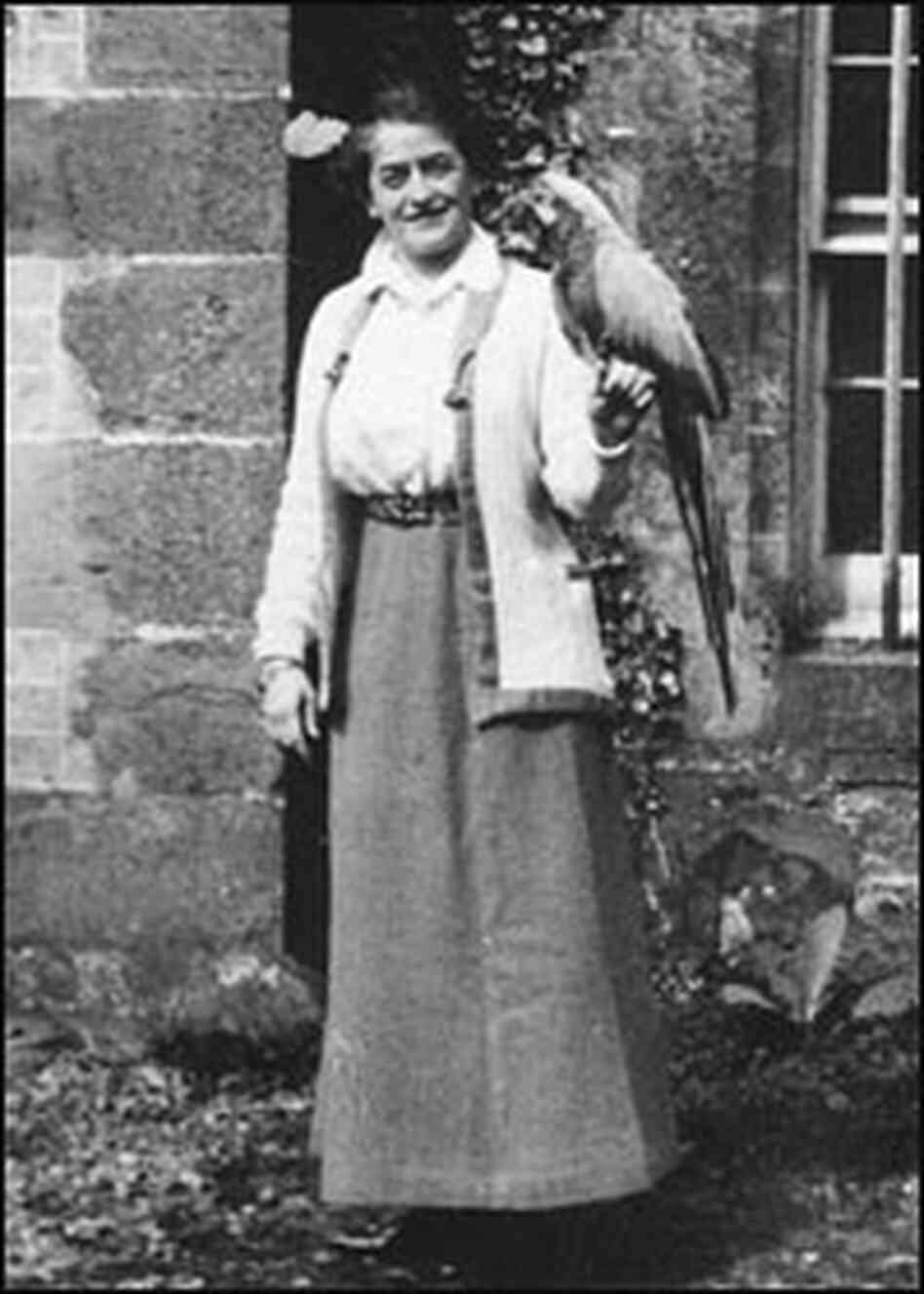 Girl Scout founder Juliette Gordon Low with a parrot.