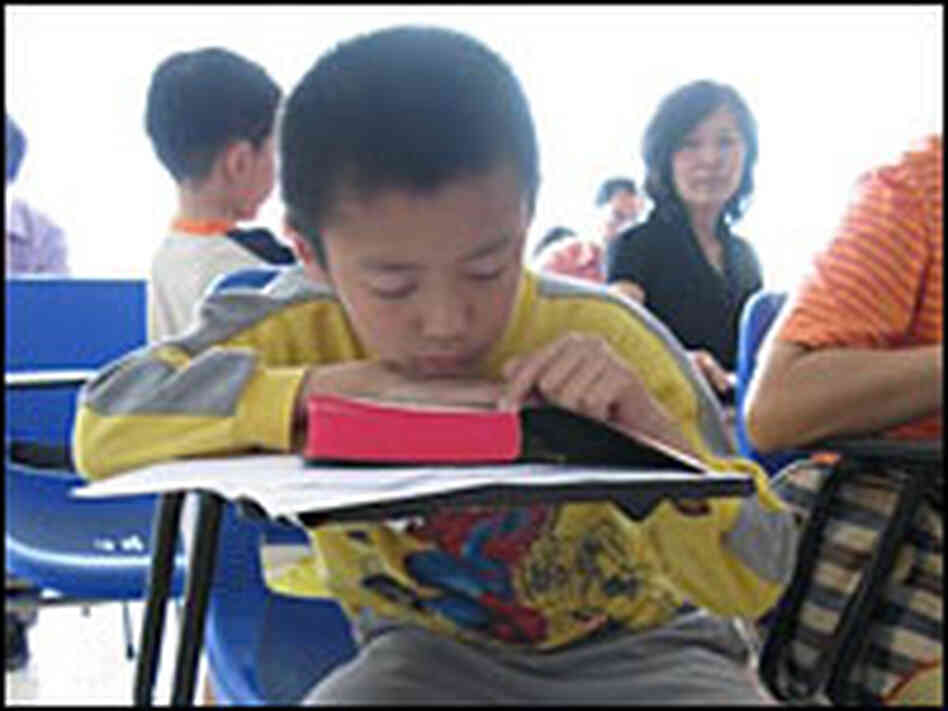 Fan Shuya, 6, attends Sunday services along with his parents May 18 at the church's temporary site. Fan Shuya, 6, attends Sunday services along with his parents May 18 at the church's temporary site.