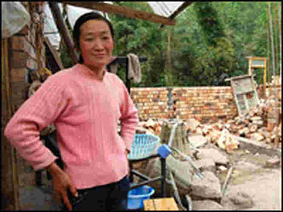 Yao Suhui stands on the site that will become her new home.