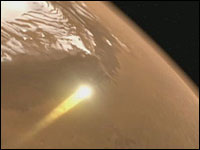 Phoenix streaks through the Martian atmosphere, protected by its heat shield. (Artist conception)
