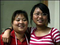 Bamboo (right), who is an only child, stands with her mother.