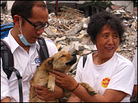 Chen Yunlian (right) and a member of the Hong Kong SPCA hold Qianjin. Chen Yunlian (right) and a member of the Hong Kong SPCA hold Qianjin.