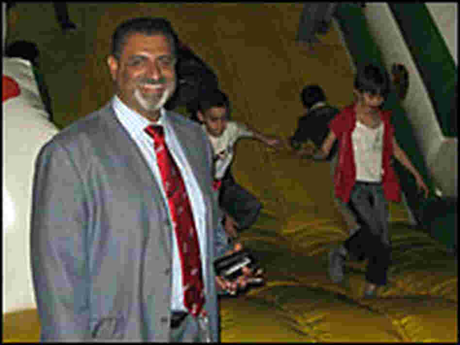 Hatim al-Bachary stands in front of one of the attractions at his newly opened amusement park.