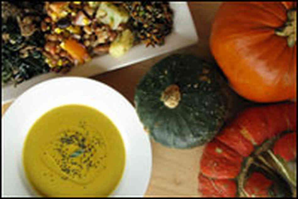 Pumpkin soup with bean salad and gourds.