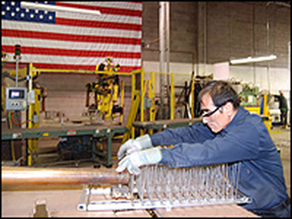 Dong Moon assembles a wire basket at Marlin Steel Wire in Baltimore. Dong Moon assembles a wire basket at Marlin Steel Wire in Baltimore.