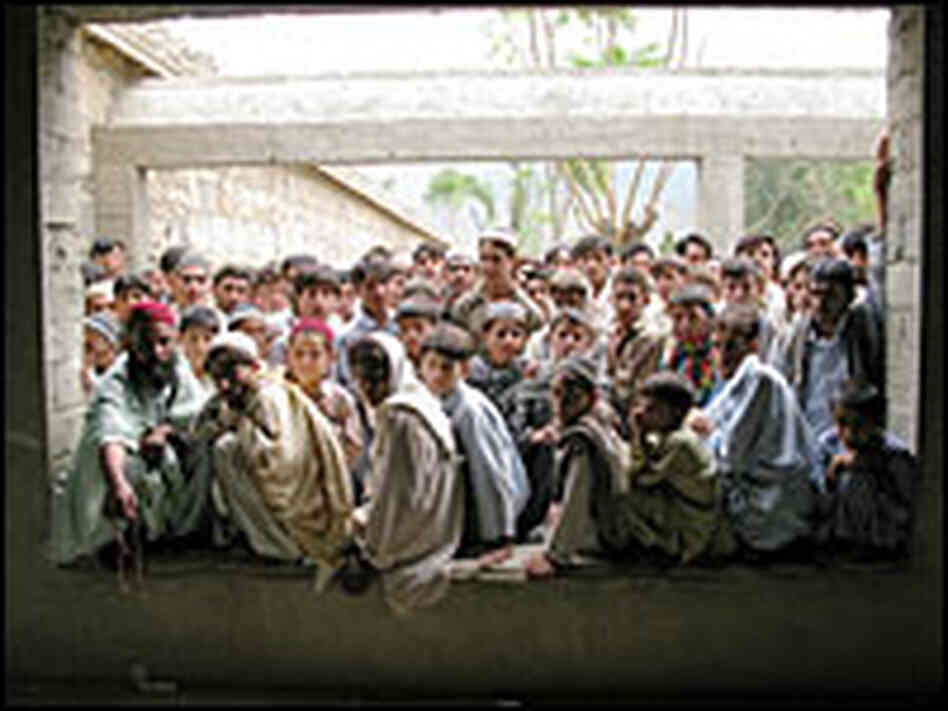 Refugees wait for food in Kunar Province, Afghanistan
